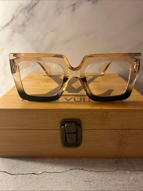Source Unknown Amber-to-Black Square clear lenses frame.